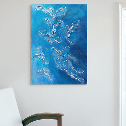 blue acrylic and texture painting hanging above white sofa