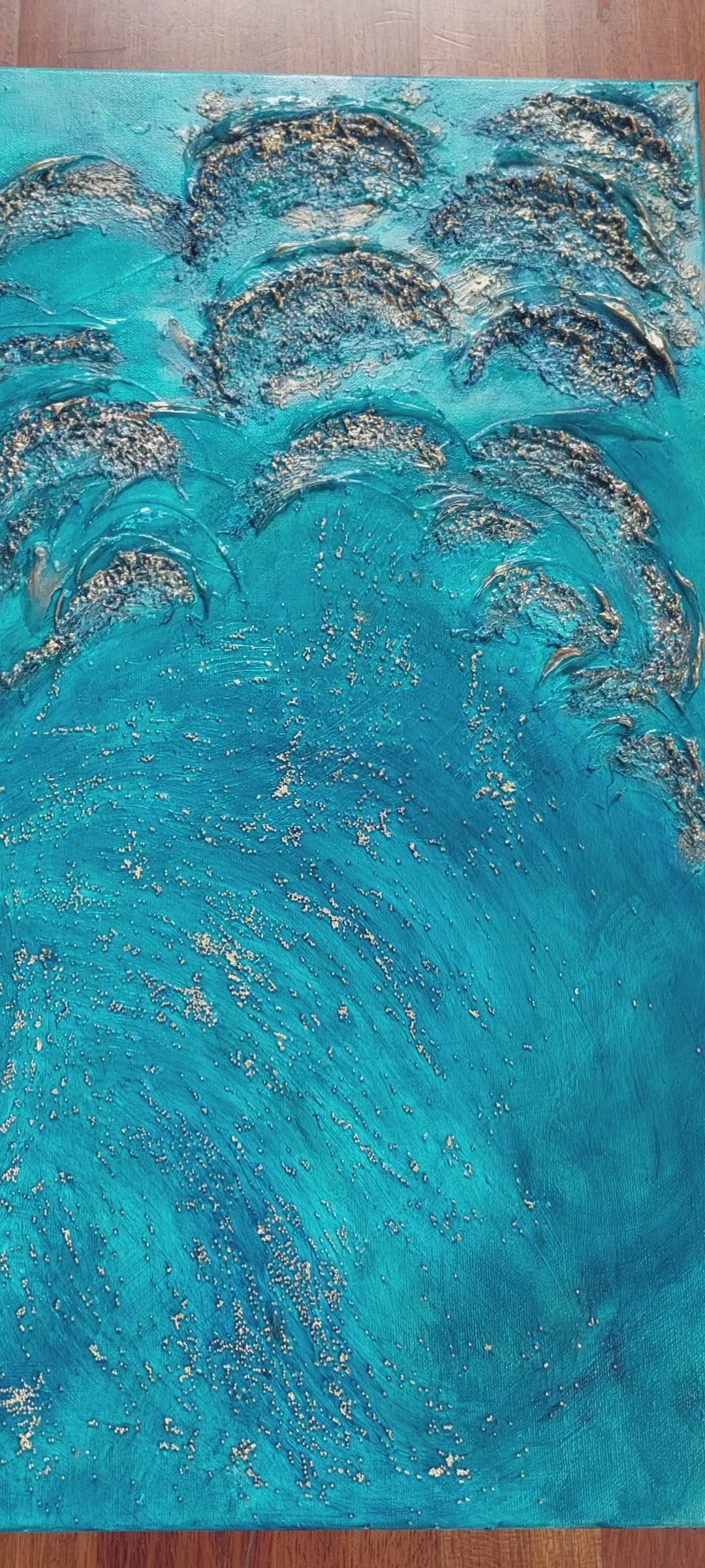 video of Heavily textured turquoise blue and gold canvas artwork