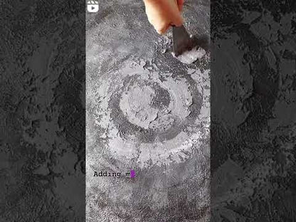 Video showing adding texture to large grey canvas painting