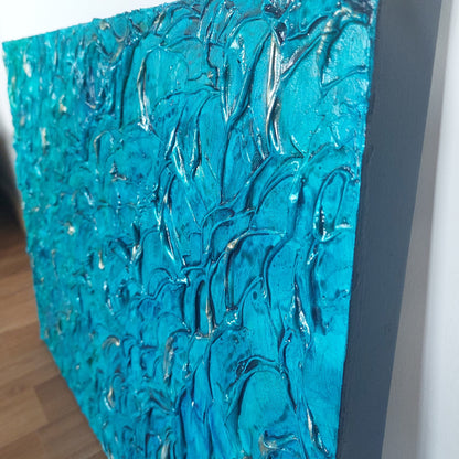 Heavily textured aqua blue painting on canvas