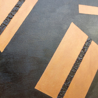 Copper and black canvas art close up photo