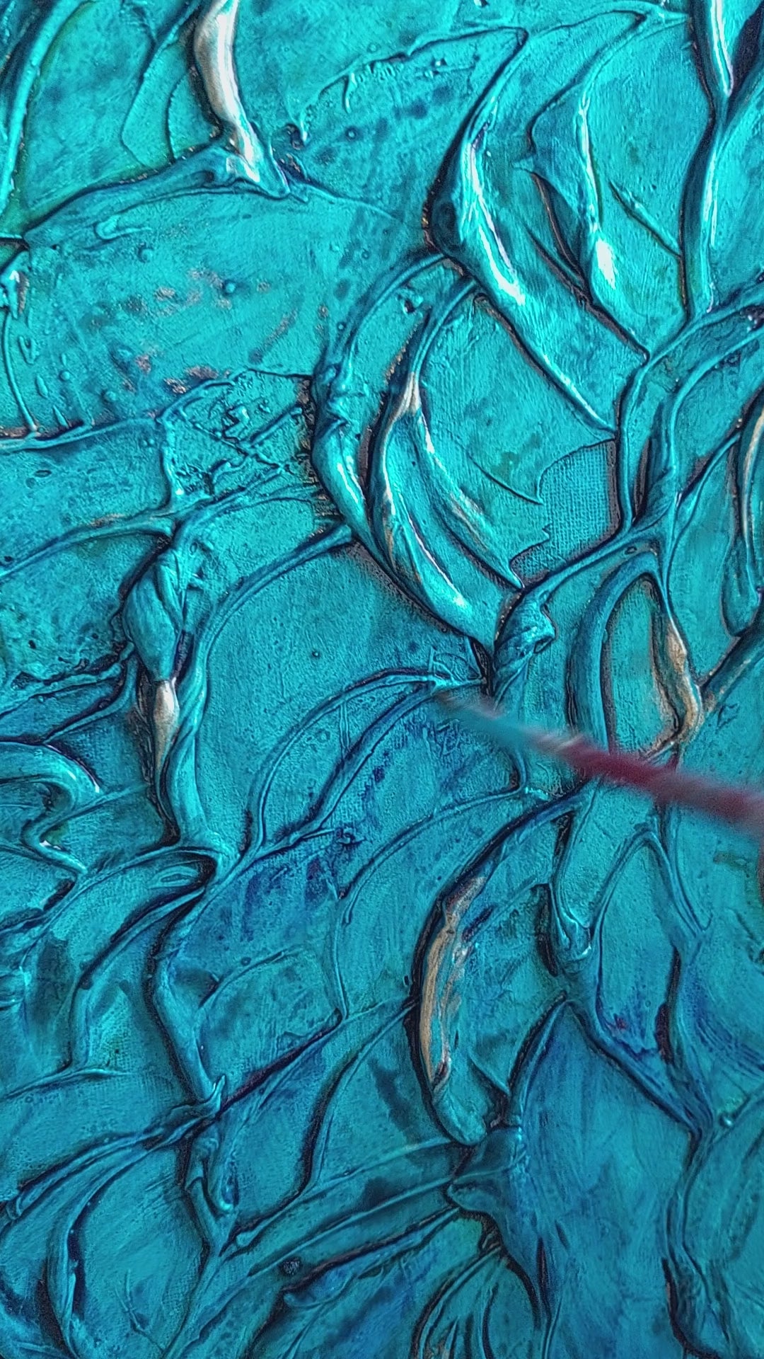 video of Heavily textured aqua blue painting on canvas